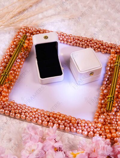 Rose gold pearl square ring plate with gold handles, ring boxes, and pink flower accent