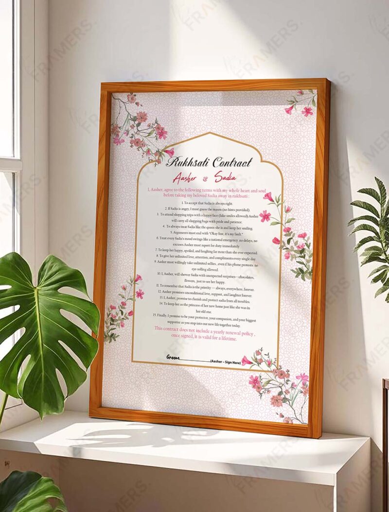 Pink floral rukhsati wedding contract in natural wood frame with Islamic pattern