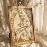 Brushed Gold Mughal Palace Architecture Nikkah Frame, standing on cream silk