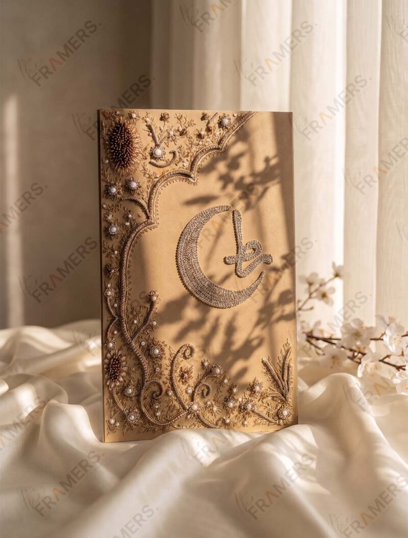 Cover of a camel and gold embroidered Nikkah booklet with a crystal crescent moon and gold initial