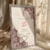 Silver Crystal Nikkah Frame with Blush Pink Florals, standing on cream silk