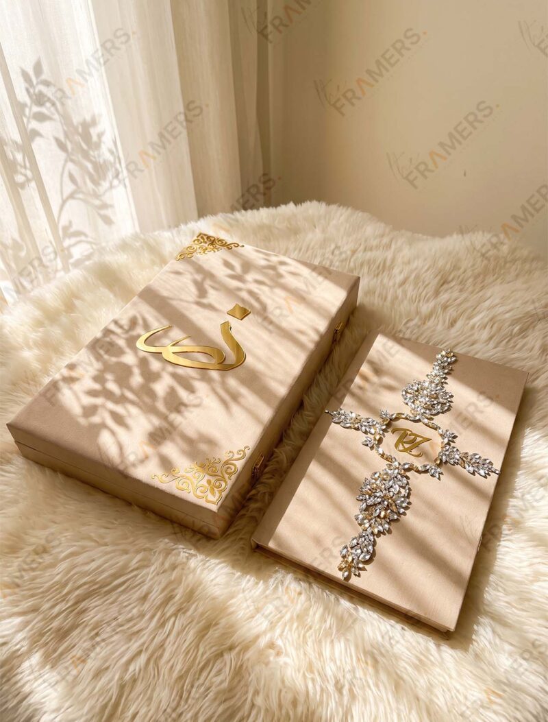 Soft gold crystal Nikkah booklet beside its matching keepsake box with gold calligraphy