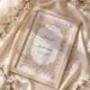 Minimalist Soft Gold Nikkah Frame with Pearl-Studded Gold Arch, standing on cream silk