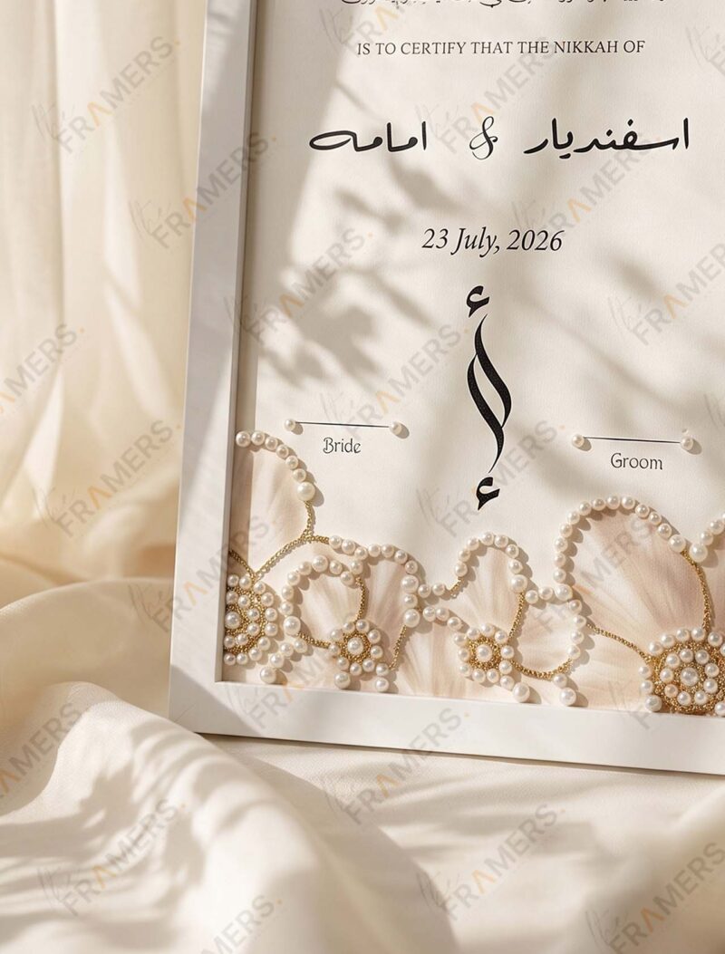 Close-up of the embellishment and names on the White Pearl Garland & Blush Rosette Embellished Nikkah Frame